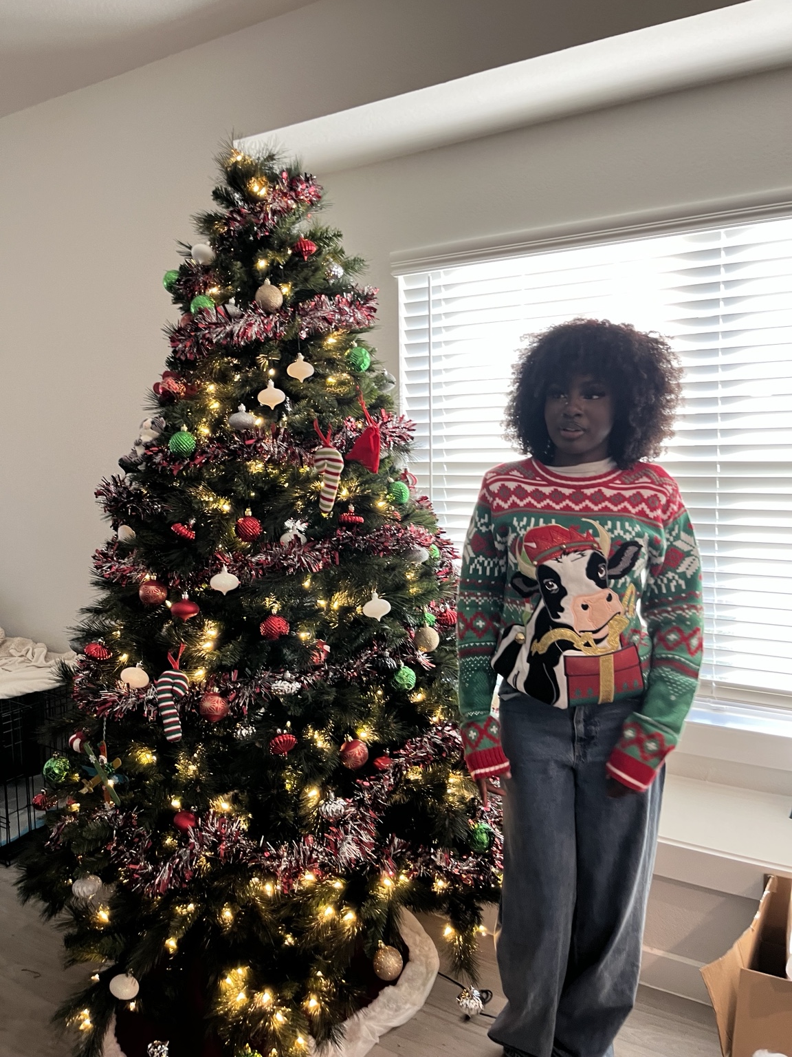 ela with chritmas tree.jpeg